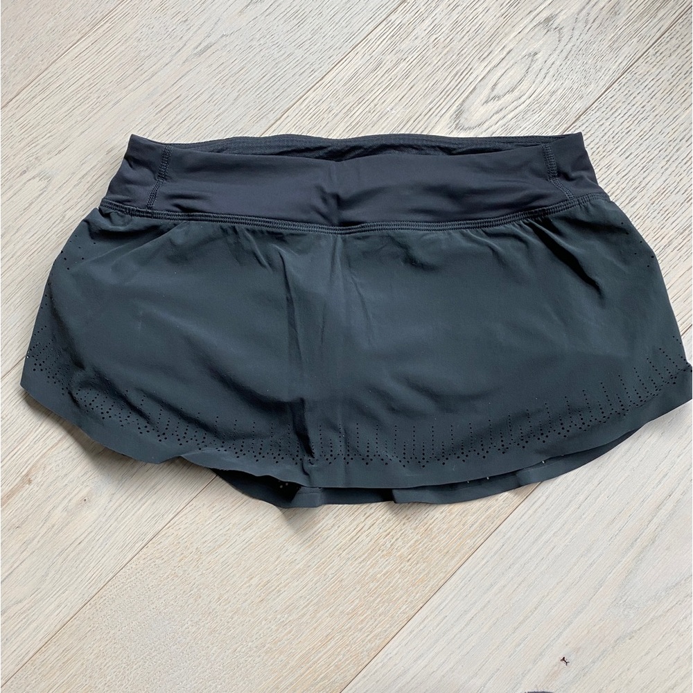 Lululemon running skirt, black, with shorts. Size 4. Excellent condition.